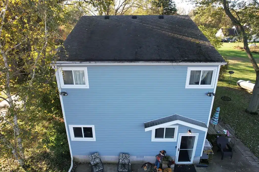old blue siding on rowland project before replacement