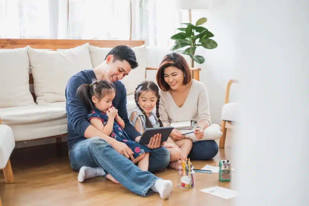 Happy family celebrating the news of their finance loan approval for shingle roof replacement