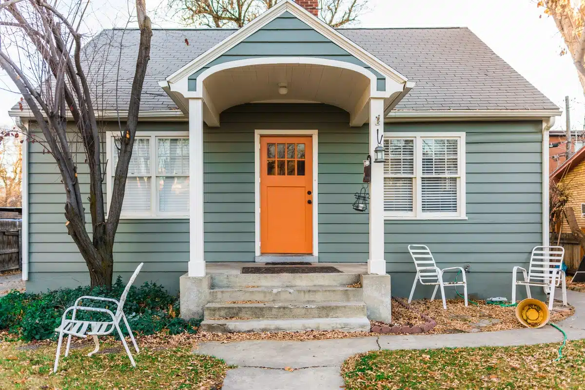 old house with a orange door before roof repair 