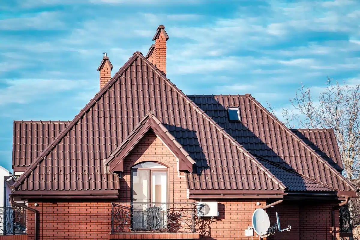 house gable roof with brown metal tiles