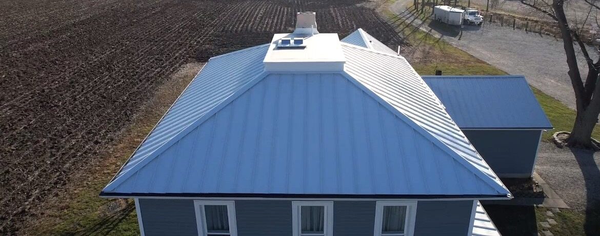 Polar white standing seam metal roofing with SMR Home Pros in-house metal.