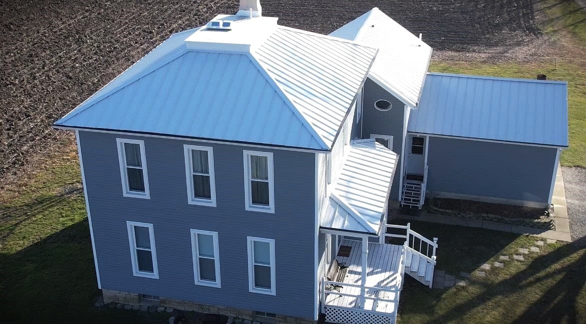 Beautiful whole home upgrade featuring metal roof replacement, vinyl siding replacement and custom windows replacement.