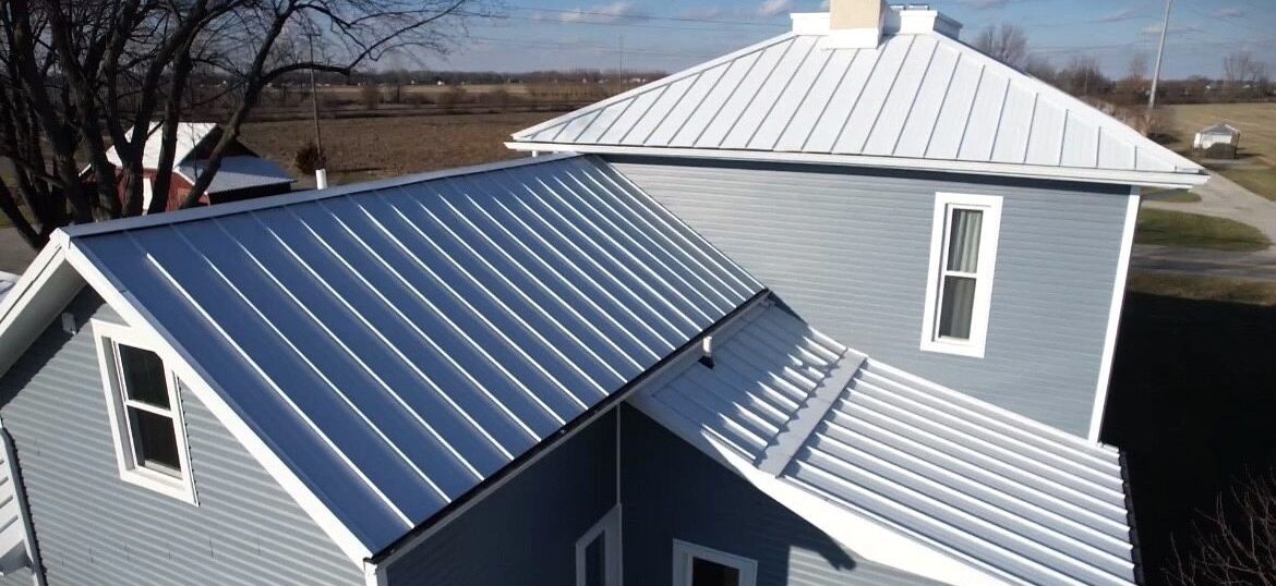 Metal roofing replacement done by SMR Home Pros featuring Polar white standing seam metal.