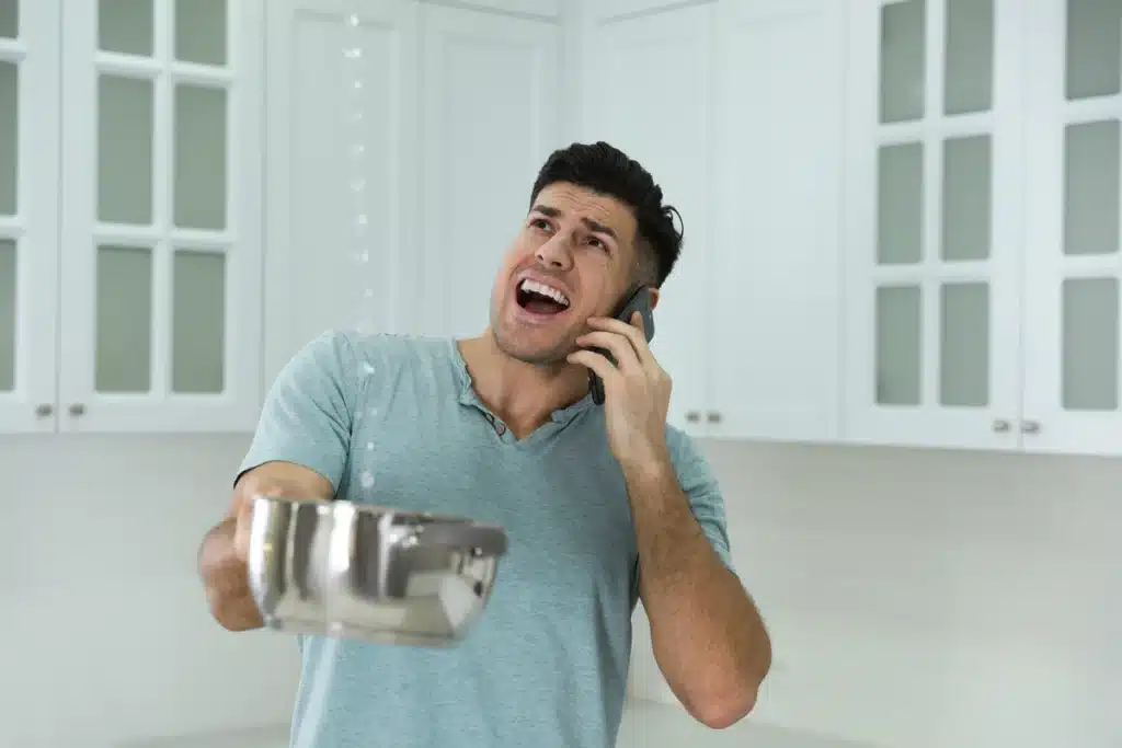 man-with-leak-in-kitchen