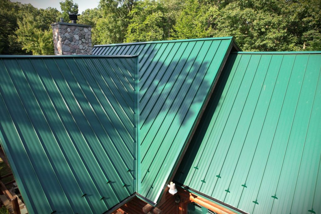 Gorgeous green metal roofing replacement done by SMR Home Pros.