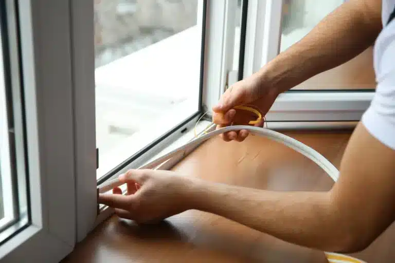 man-sealing-window