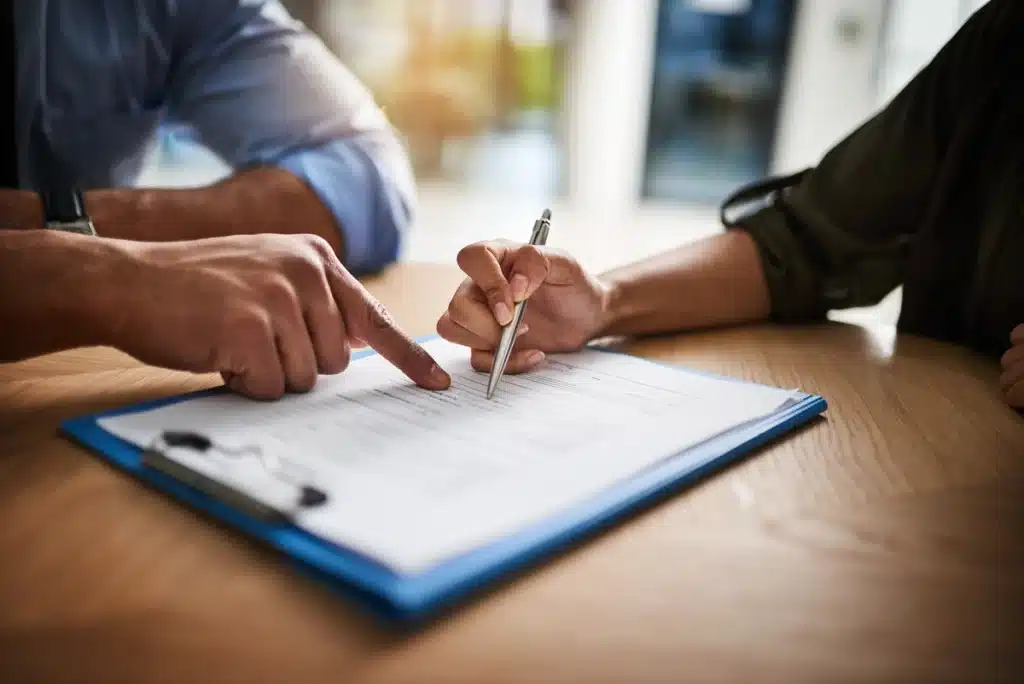 a homeowner goes over their roof damage insurance claim