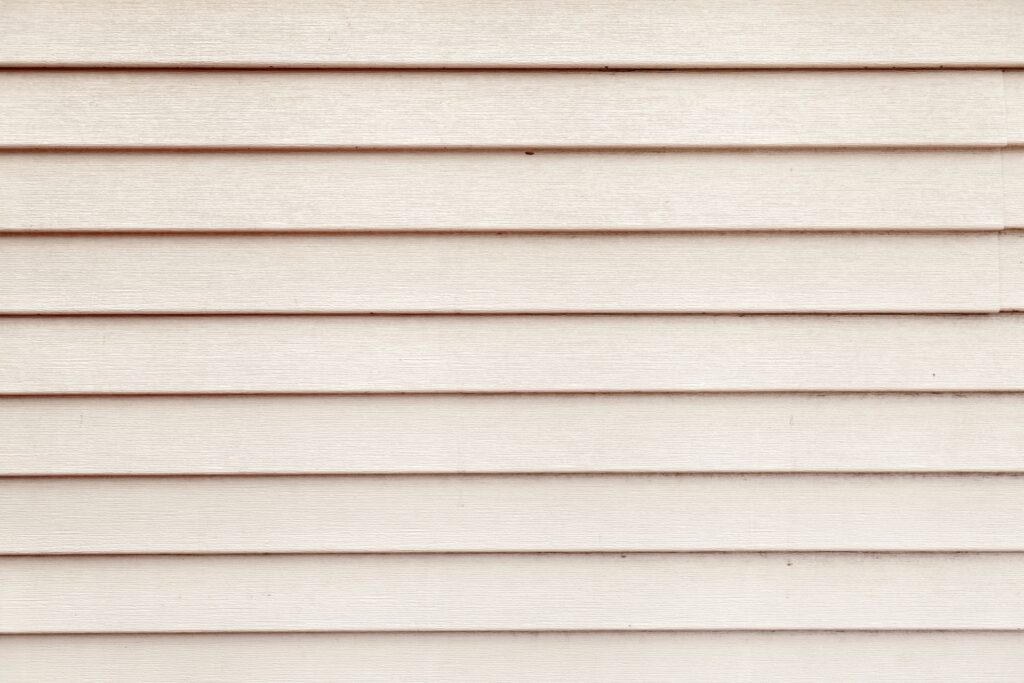 Horizontal panels with beveled edges, adding visual interest to the house's exterior.
