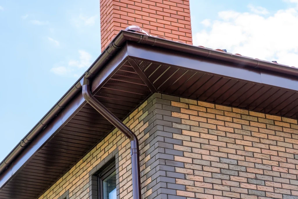 soffit-on a brick house with black soffits