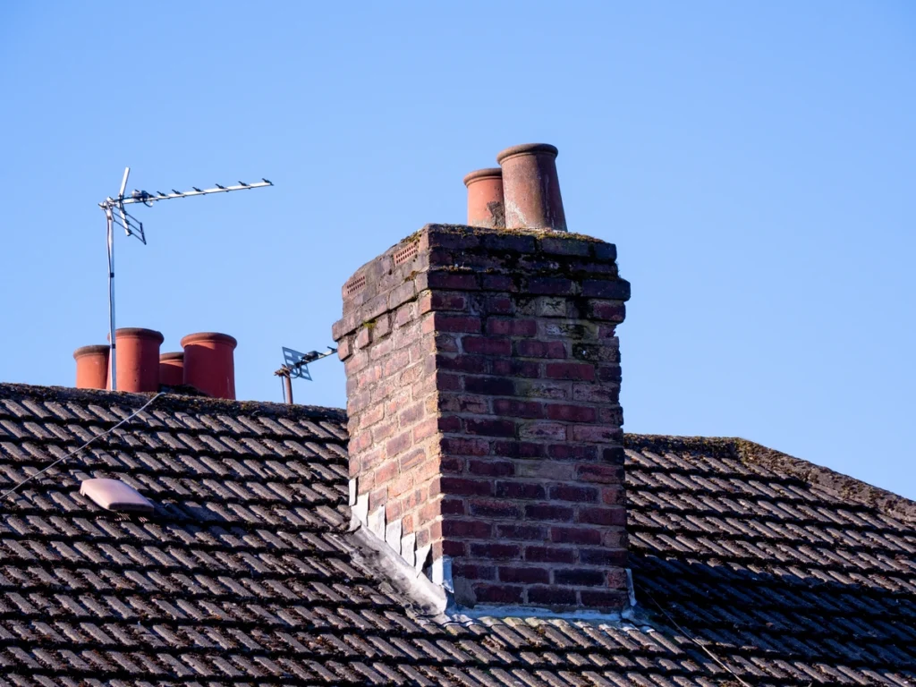 chimney flashing repair-older brick chimney and flashing on roof