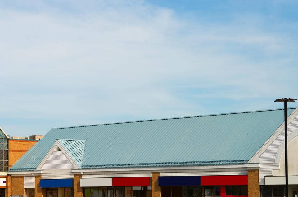 commercial metal roofing-strip mall with green metal roofing