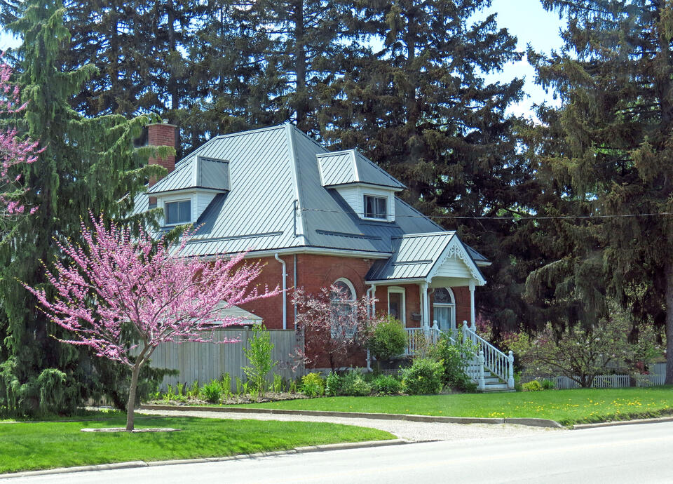 metal roofing panels-brick home with metal roofing