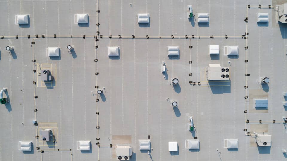types of commercial roofing-arial view of white commercial roofing
