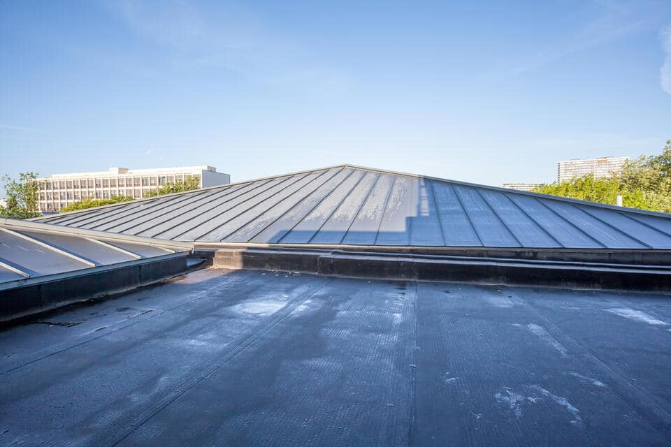types of commercial roofing-two types of dark roofing on a commercial flat roof