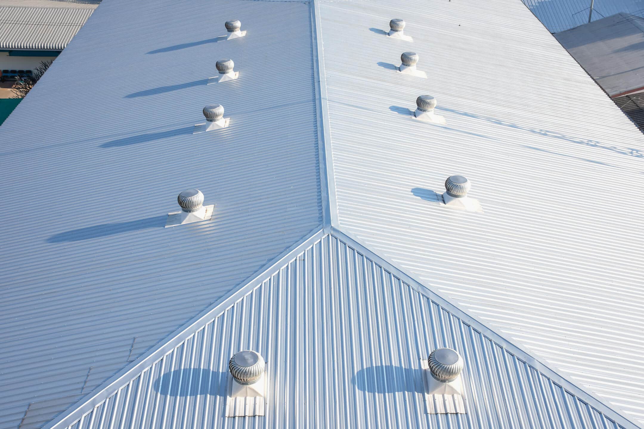 types of commercial roofing-white metal roofing on commercial building