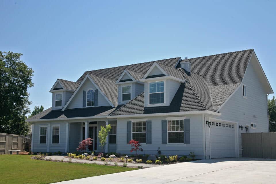 how to pay for a new roof-white sided home with new gray shingle roof