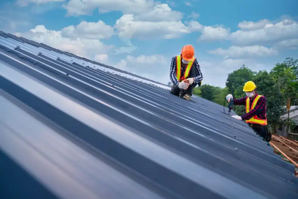 professional roofers installing new metal roof