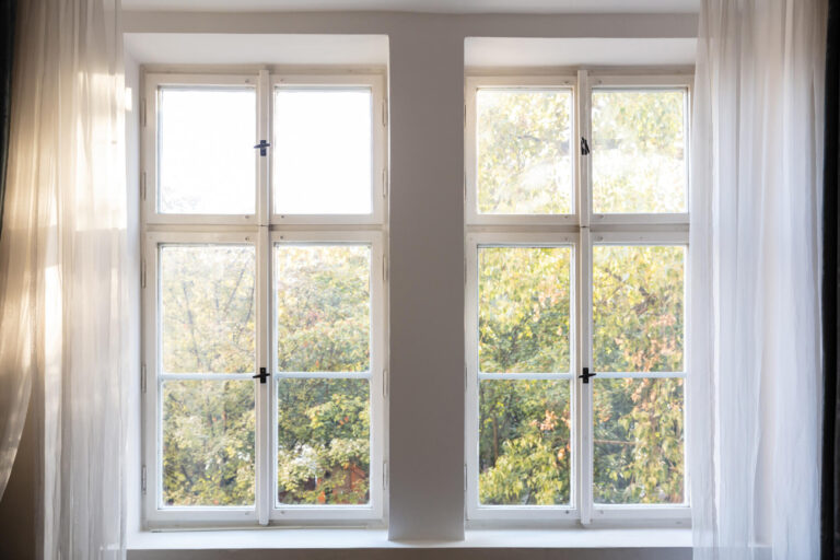 how long do windows last-pretty view out of two windows surrounded by white curtains