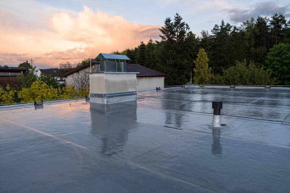 single ply membrane roof-flat residential roof overlooking backyard and neighborhood