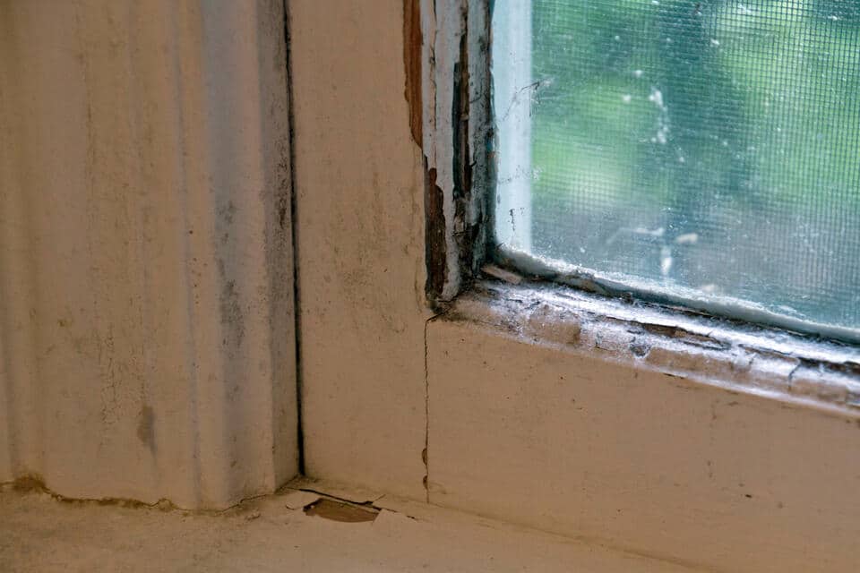 how long do windows last-close up of old and damaged window materials in house